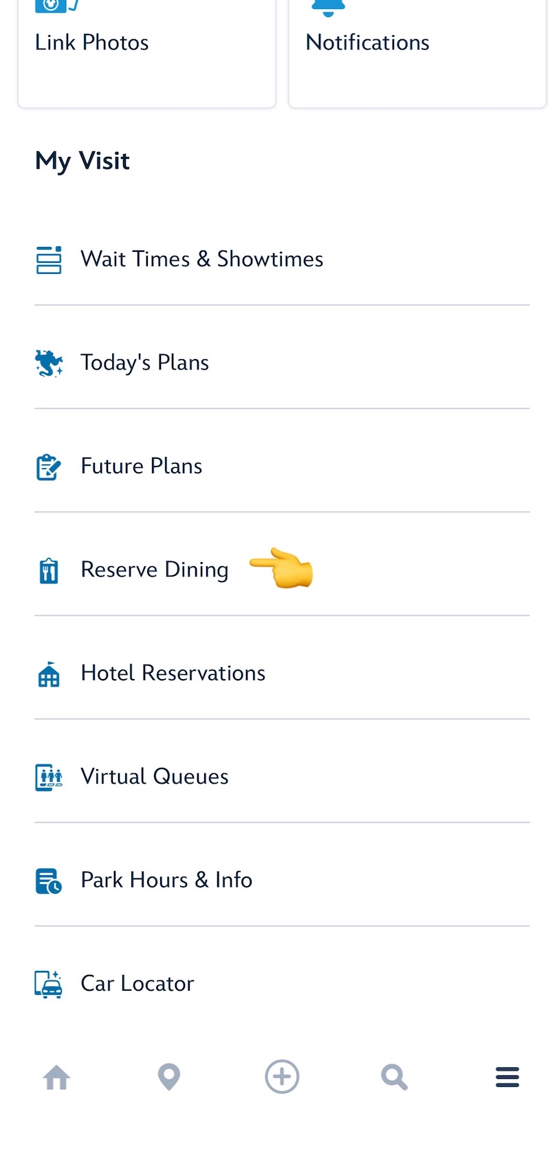 ディズニーランド公式アプリのReserve Diningボタンに指マークで印がついているスクリーンショット